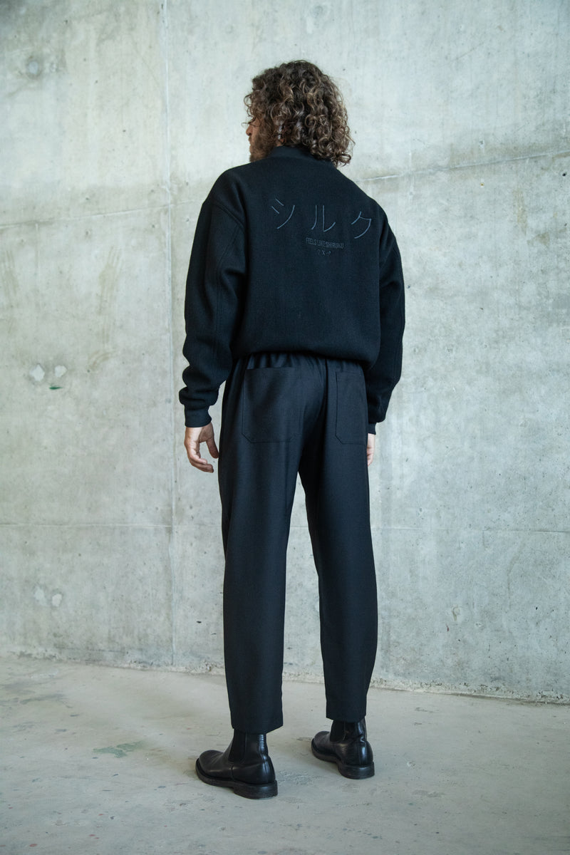 ANGLED HEM BLACK WOOL GABARDINE TROUSERS WITH CUSTOM EMBROIDERIES