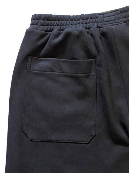 Black pants with a pocket on a white background