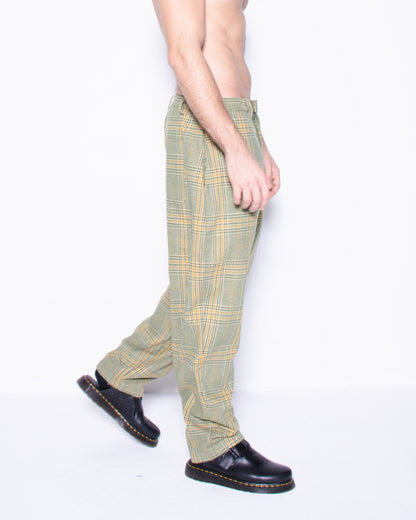  Person wearing green english wool striped  plaid  pants on a white background