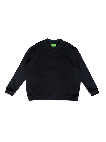 Black sweatshirt with a small green logo on a white background