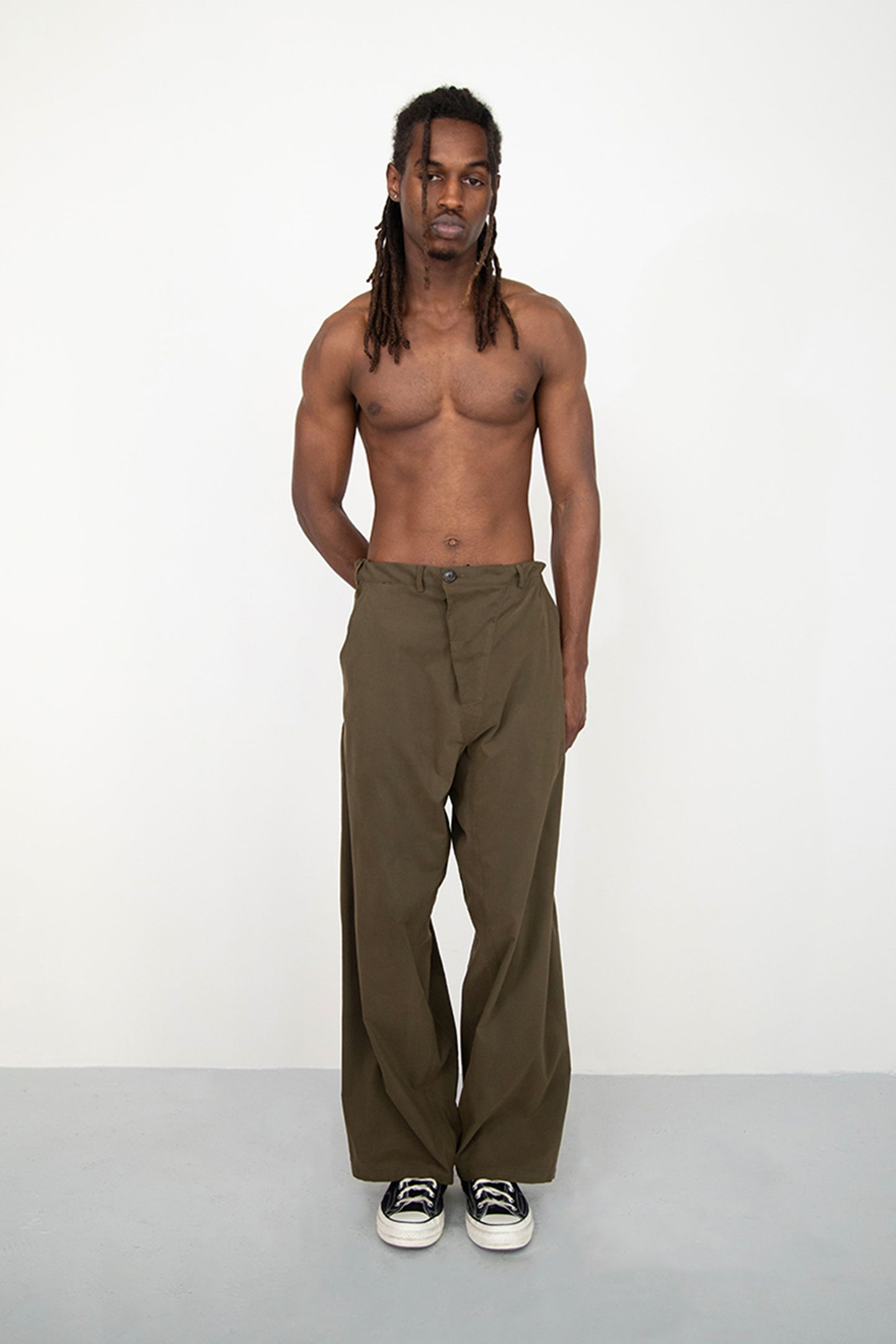 CONSTRUCTED KAKI TROUSERS WITH DIAGONAL BUTTONED FLY