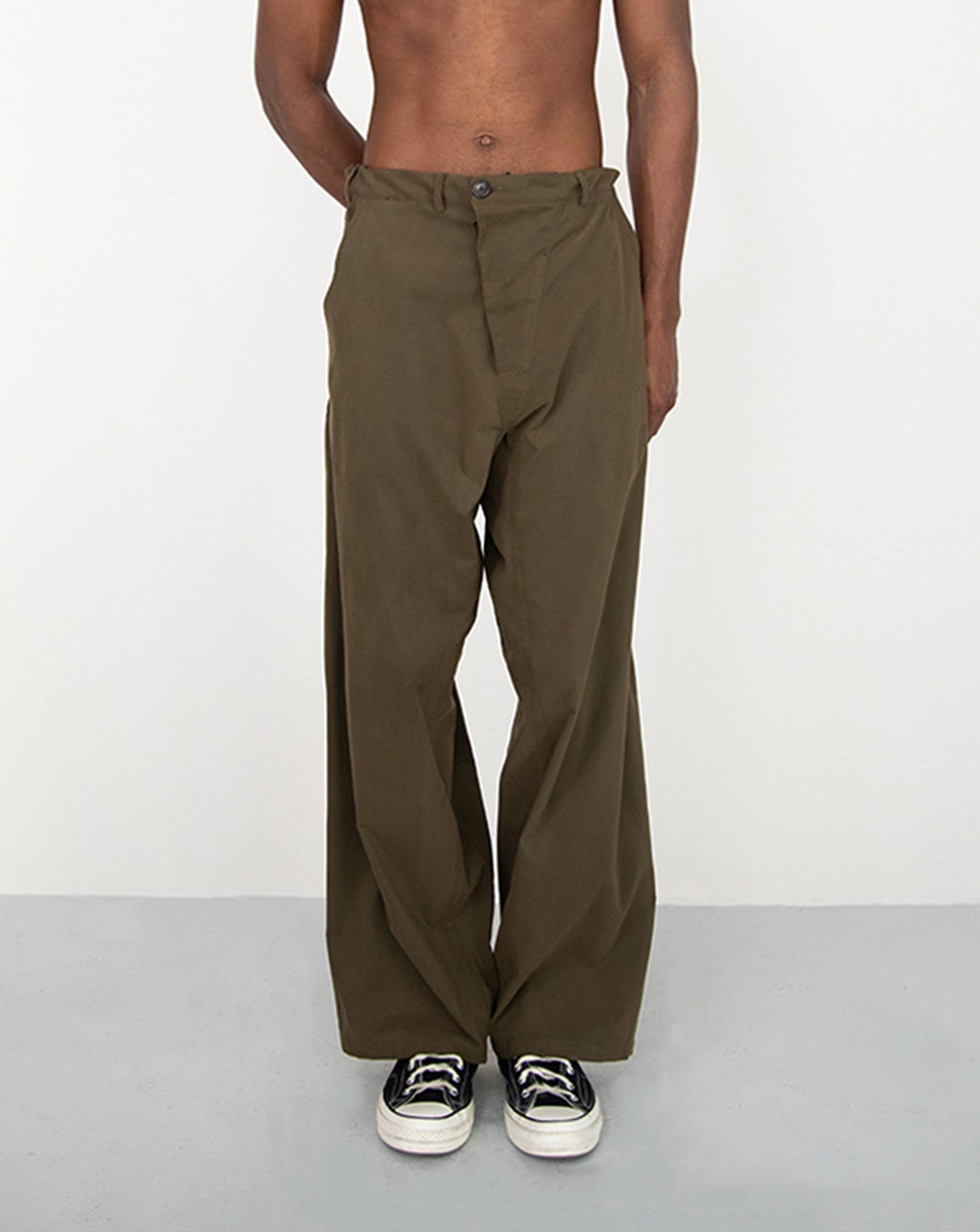 CONSTRUCTED KAKI TROUSERS WITH DIAGONAL BUTTONED FLY