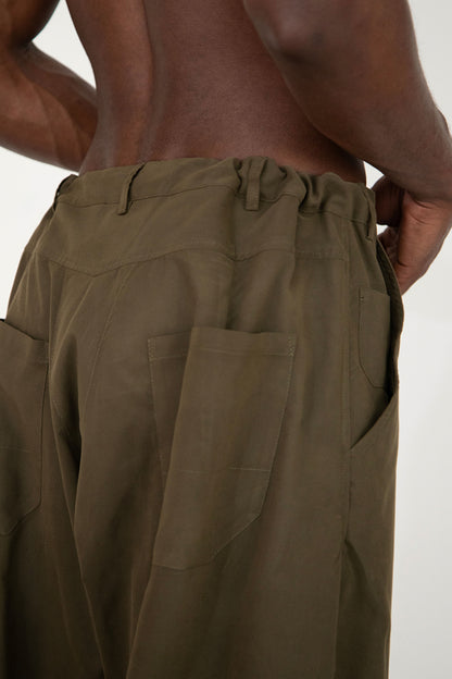 CONSTRUCTED KAKI TROUSERS WITH DIAGONAL BUTTONED FLY