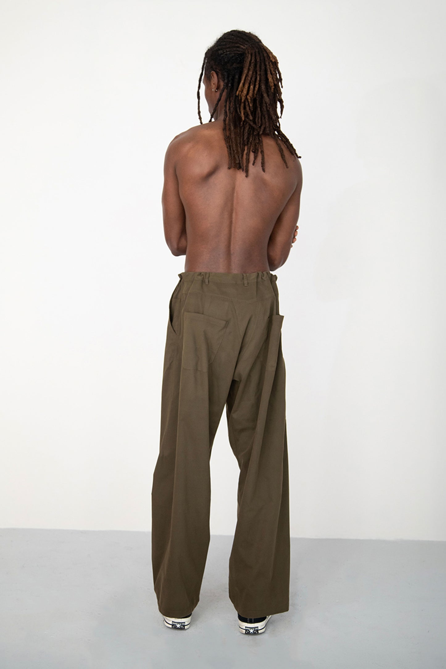 CONSTRUCTED KAKI TROUSERS WITH DIAGONAL BUTTONED FLY