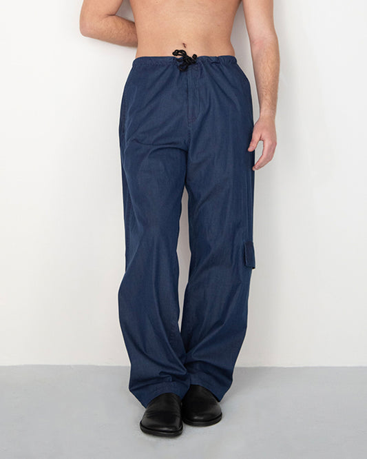 RINSED INDIGO PIGMENT DYED BAGGY TROUSERS WITH SIDE POCKET